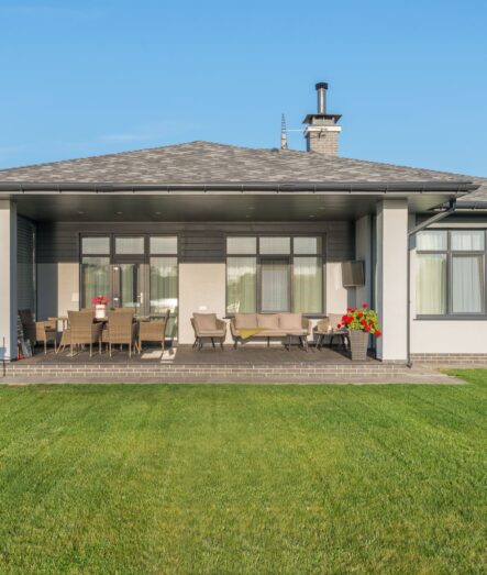 Healthy manicured lawn behind a family home